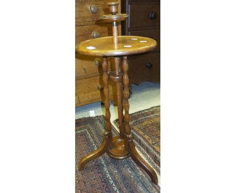 A Victorian mahogany adjustable candle table on tripod base, the circular top on triple turned supports to cabriole legs unit