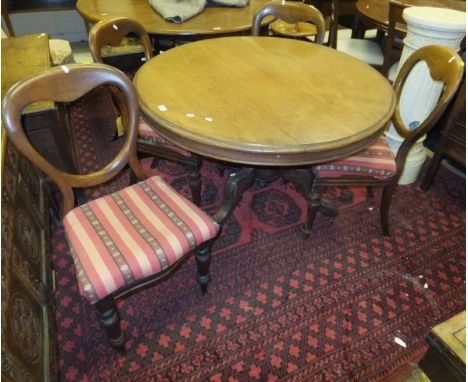 A Victorian mahogany circular breakfast table on tripod base, together with a set of four Victorian mahogany balloon back din
