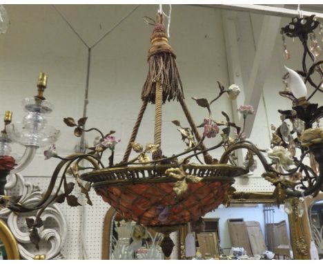 A gilt metal three branch ceiling light fitting of basket form with applied ceramic floral decoration, with rope hangings