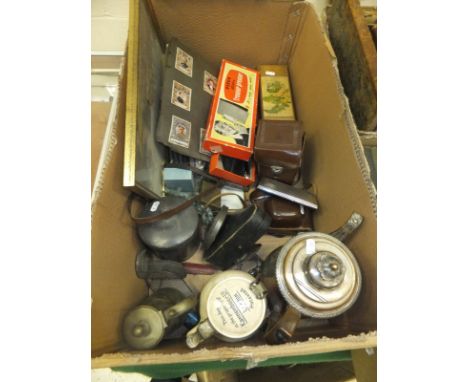 A box containing assorted silver and plated wares, to include an engine-turned cigarette case and a cased silver egg cup and 