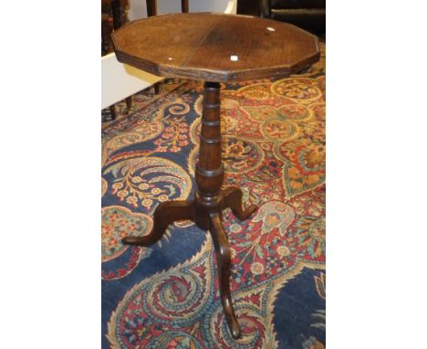 A 19th Century oak occasional table, the dodecagon snap top on a turned and ringed pedestal to cabriole tripod base, together