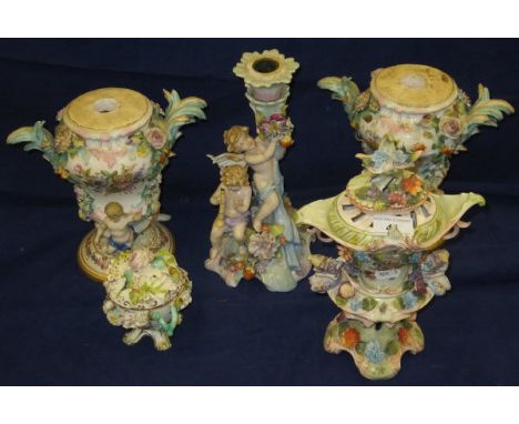 A pair of Meissen relief work decorated vase shaped lamp bases, a Dresden porcelain candlestick / centre piece base, a Dresde