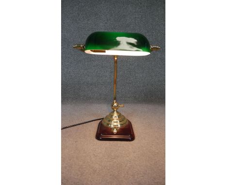 A brass bankers desk lamp with green glass adjustable shade, mounted on a wooden base. Working. H.40 W.30 