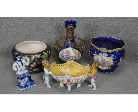A collection of ceramics. Including a Windsor Art Ware budgeriegar and blossom design planter, a Russian blue and white hand 