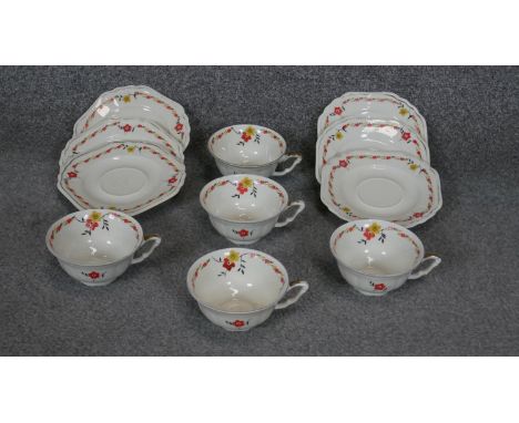 An Art Deco transfer printed floral design six person porcelain tea set (two cups missing), 11 pieces in total. Makers stamp 