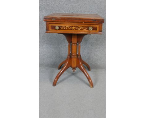 A 19th century style walnut envelope card table with floral satinwood inlay and frieze drawer on quadruped base. H.73 Dia.54c