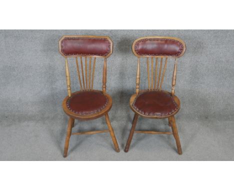 A pair of late 19th century oak stick back chairs. 