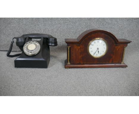 A vintage black bakelite telephone along with a Mappin &amp; Webb Art Nouveau parquetry mahogany mantle clock with brass colu