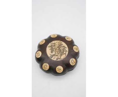 A 20th century Chinese Feng Shui rosewood and bone compass. In a rosewood case with eight bone circular plaques around the ed
