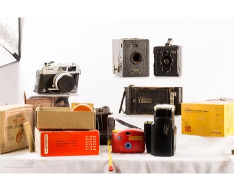 A quantity of vintage cameras and photography accessories.
