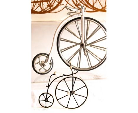 Early Bicycles by Philip Summer, illustrated by Alan Osbahr, together with two model bicycles. 
