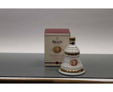 BELL'S CHRISTMAS 2000 BELL
Blended Scotch Whisky in white and gold Wade ceramic decanter. 70cl, 40% volume, in carton. CONDIT