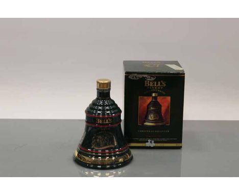 BELL'S CHRISTMAS 1992 BELL
Blended Scotch Whisky in green  Wade ceramic decanter. 70cl, 40% volume, in carton. CONDITION REPO