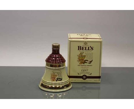 BELL'S CHRISTMAS 1997 BELL
Blended Scotch Whisky in cream and brown  Wade ceramic decanter. 70cl, 40% volume, in carton. COND