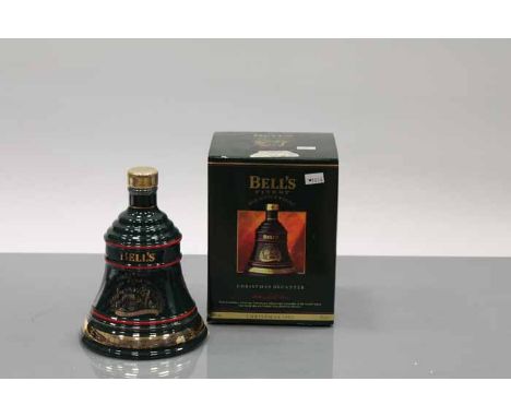 BELL'S CHRISTMAS 1992 BELL
Blended Scotch Whisky in green  Wade ceramic decanter. 70cl, 40% volume, in carton. CONDITION REPO