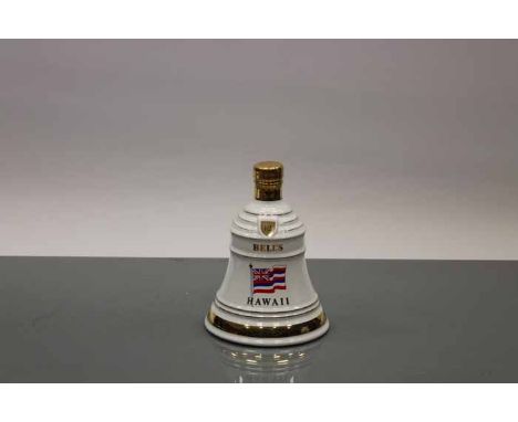 BELL'S HAWAII
Blended Scotch Whisky in white and gold Wade ceramic decanter. 75cl, 43% volume.
 CONDITION REPORT: Very good.