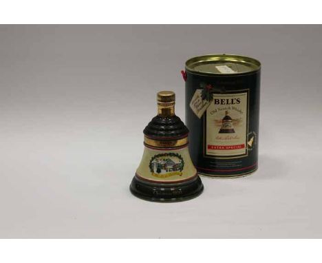 BELL'S CHRISTMAS 1990 BELL
Blended Scotch Whisky in green and yellow Wade ceramic decanter. 75cl, 43% volume, in tube. CONDIT