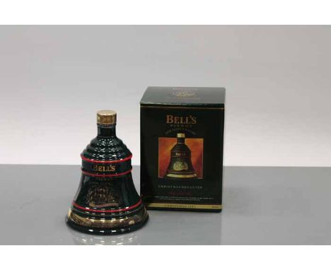 BELL'S CHRISTMAS 1993 BELL
Blended Scotch Whisky in green Wade ceramic decanter. 70cl, 40% volume, in carton.
 CONDITION REPO