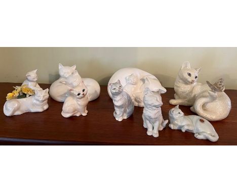 A selection of porcelain cats various makers including Royal Doulton, Crown and Royal Worcester 