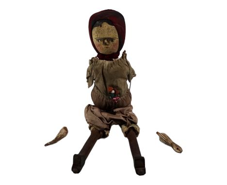 A 19th century wooden peg doll - with painted head and close-fitting plaid head scarf, also jointed limbs, wearing a cotton d