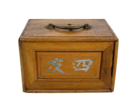 A late 19th century mahjong set - in a camphor wood box, the tiles of bone and bamboo, width 23cm.