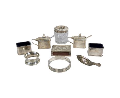 A pair of Art Deco style mustards - Birmingham 1928, Walker &amp; Hall, together with a pair of salts, a caddy spoon and smal