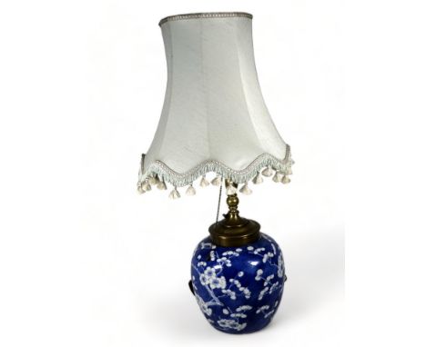 A late 19th century ginger jar converted as a lamp - with blue and white prunus decoration, four character mark to base, heig