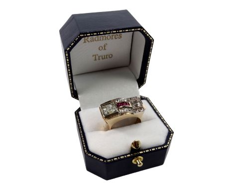 An Art Deco diamond and ruby set ring - the principal rose-cut stone of approx. 1ct, with a further eleven diamonds and a pav