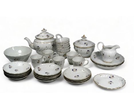 An early 19th century Flight, Barr and Barr Worcester part tea service - comprising a teapot, sucrier, milk jug, slop bowl, t