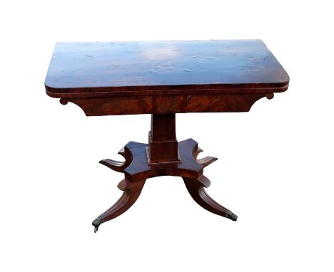 A William IV mahogany card table - the rectangular fold-over top above a square tapering support and plinth base, on short mo