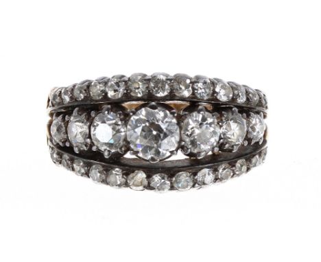 Good quality three row diamond dress ring, consisting of thirty-three graduating old-cut diamonds set in white metal on a yel