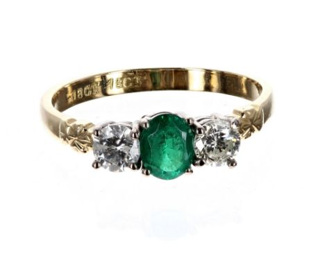 18ct emerald and diamond three stone ring, with an oval emerald flanked with two round brilliant-cut diamonds, each 0.15ct ap