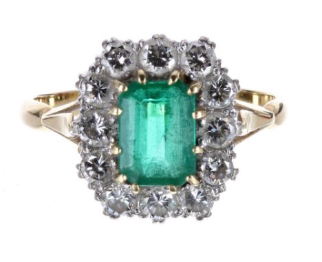 18ct emerald and diamond cluster ring, the emerald 0.81ct approx, in a surround of twelve round brilliant-cut diamonds, 0.72c