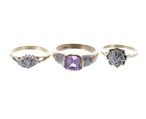Two 18ct diamond set cluster rings, 4.8gm; also a 9ct amethyst and diamond ring, 4gm (3)