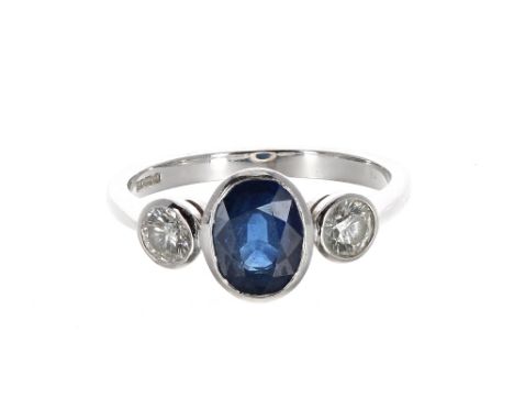 Good 18ct white gold sapphire and diamond three stone ring, rub-over set sapphire of a rich blue colour 1.70ct approx, with t