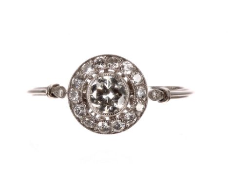 Platinum diamond cluster ring, the central diamond 0.36ct approx, clarity VS1-2, colour K/L, within a fourteen diamond cluste