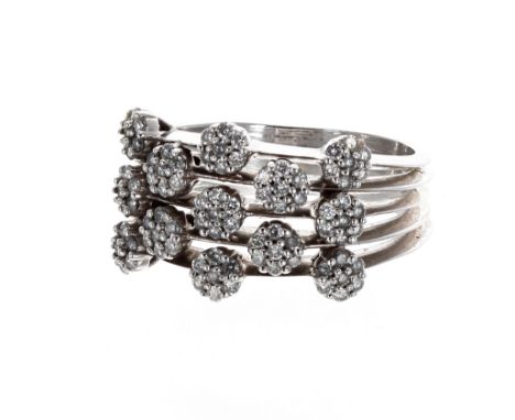 Modern 18ct white gold diamond dress ring, applied with thirteen floral set clusters on split shoulders, 9.5gm, band width 13