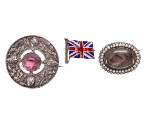 Three interesting brooches to include a 19th century gold mourning brooch, inset with woven hair in a seed pearl border, 9.3g