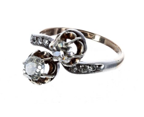Antique diamond cross-over design ring, with two claw-set old-cut diamonds 1.10ct, clarity SI1-2, colour I/J with set shoulde
