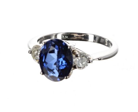 Good 18ct white gold sapphire and diamond three stone ring, the oval sapphire 2.10ct approx, with two round brilliant-cut dia