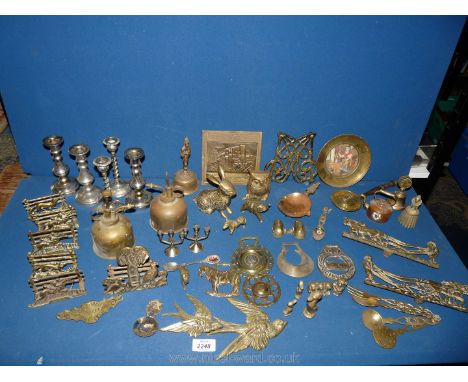 Two boxes of brassware to include; letter racks, horse brasses, oil cans, a warming pan, candle sticks, hand bells, ornaments