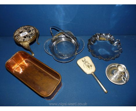 A box of metal items including candlestick, brass trivet, etc.