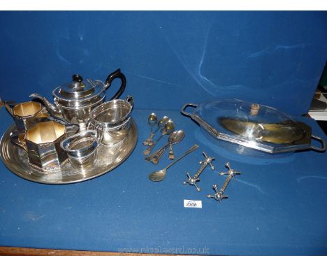 A quantity of silver plated items including a large serving dish, three piece tea set, six teaspoons, knife rests, sucrier an