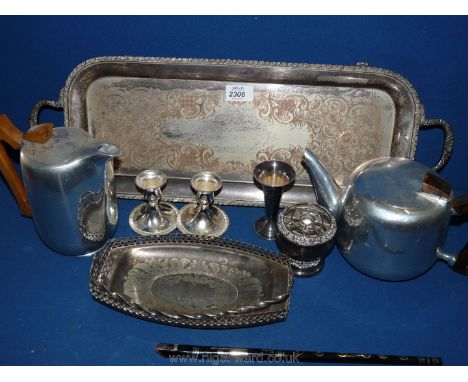 A quantity of plated items including long narrow tray, cake basket, pair of dumpy candlesticks, etc. plus a Picquot ware teap