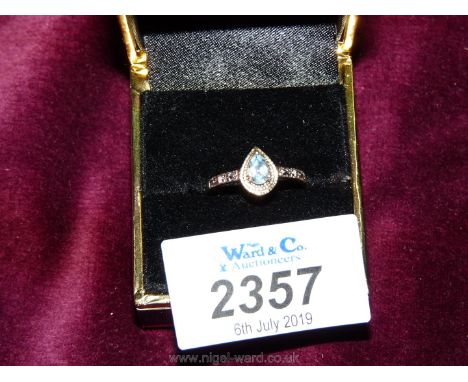 A 9ct 375 gold Ring with pear shape Aquamarine stone and chip diamonds, boxed.