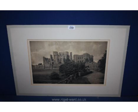 A mounted print of a castle.