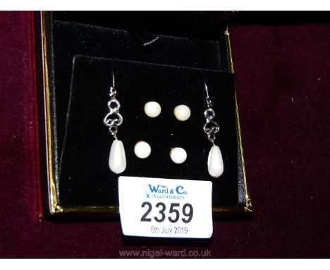 Three pairs of pearl earrings, boxed.