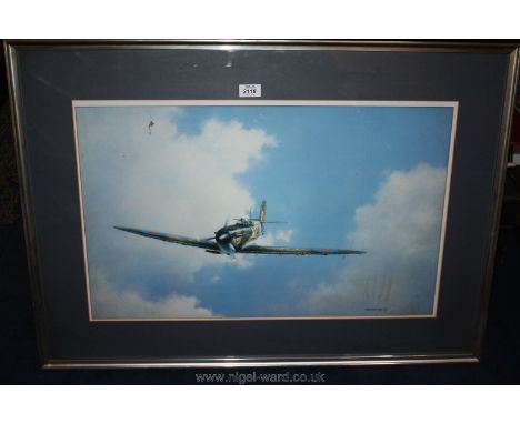 A large framed and mounted Print of 'The Solo Spitfire', signed lower right Anthony Hedges