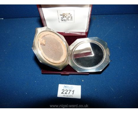 A silver plate powder compact with embossed initials in box.