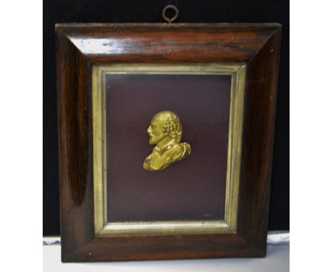 A 19th century gilt metal portrait plaque, rosewood frame
